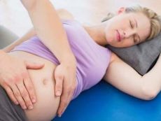 Болит низ живота слева при беременности