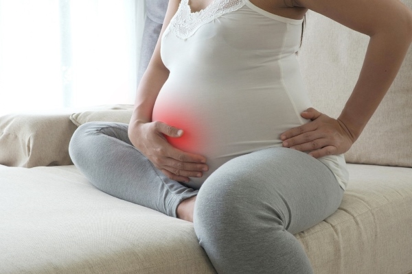 Боль в районе пупка при беременности