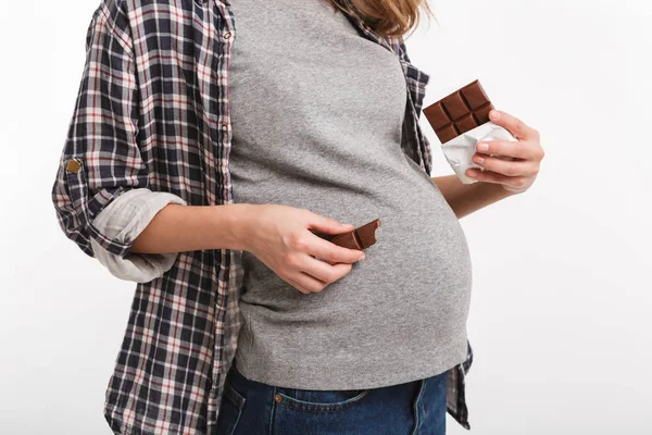 Chocolate near belly — стоковое фото